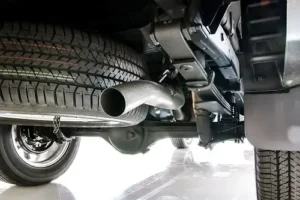 Diesel Emissions Testing in Colorado: What You Need to Know | Branch Automotive in Littleton, CO. Closeup image of an exhaust pipe of a pickup car. Concept image of emissions testing.