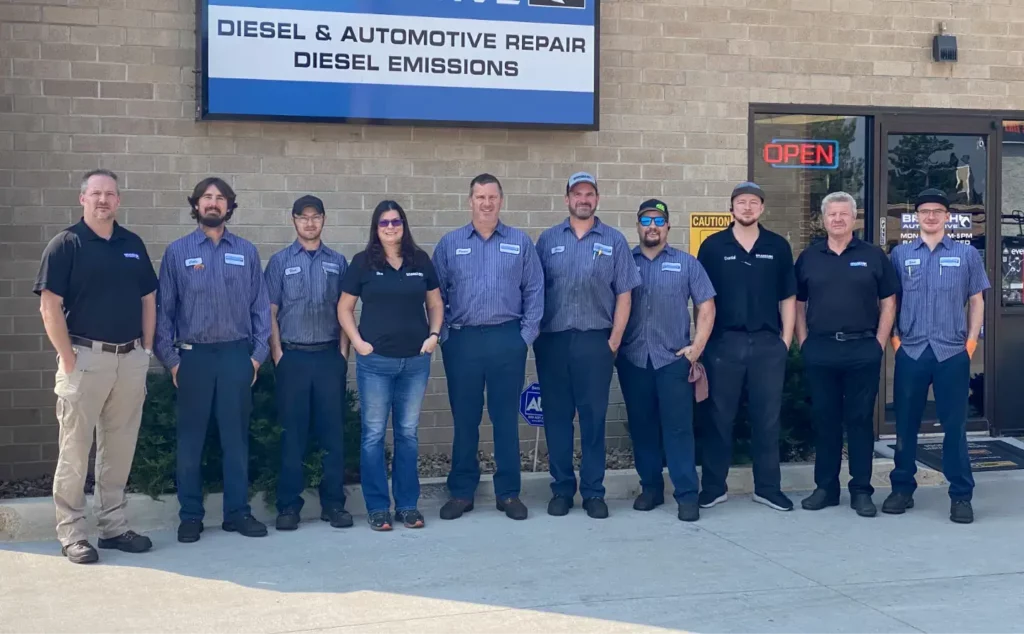close up image of owner Parker Branch and employees posing outside of Branch Automotive