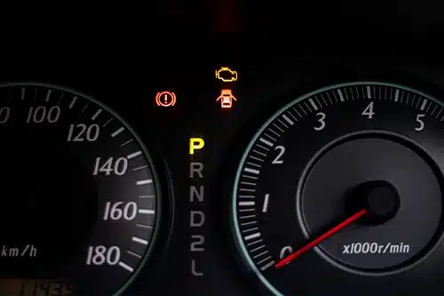The Top 5 Check Engine Light Causes on a Duramax Diesel Truck. The warning lights of car engine check, door opened, parked and hand break in the speedometer of a vehicle.