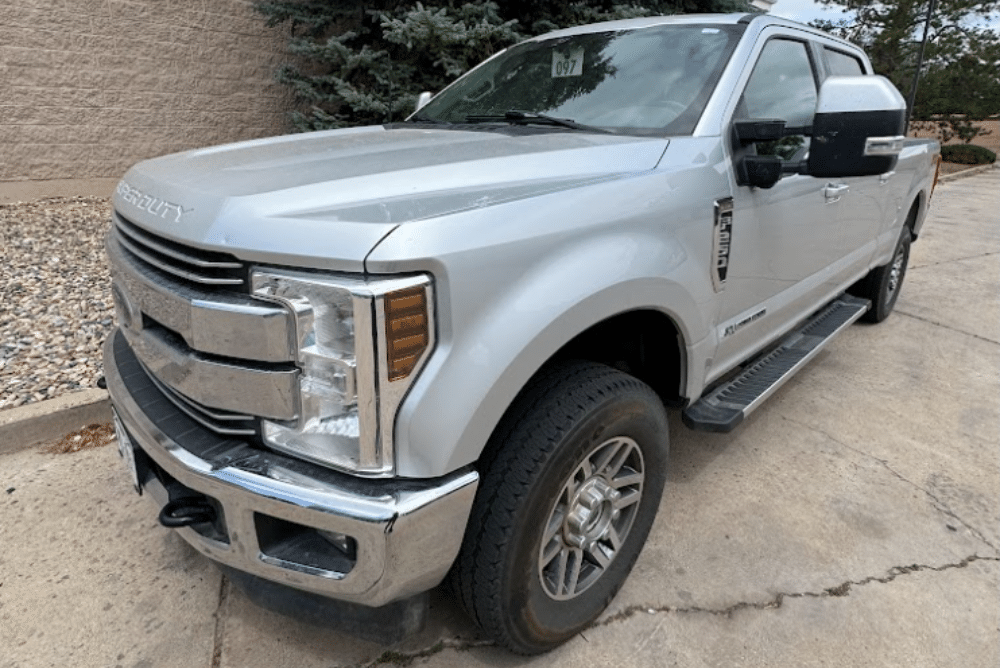 Expert Ford Powerstroke Diesel Engine Maintenance by Branch Automotive in Littleton, CO. Image of a silver Ford truck ready for top-tier service and maintenance.