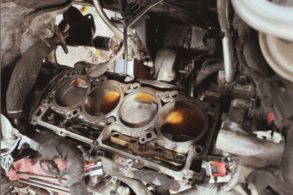 Head Gasket Repair in Littleton, CO, by Branch Automotive. Image of a diesel engine with the cylinder head removed, showcasing the intricate components requiring professional repair services, highlighting the expertise at Branch Automotive in Littleton, CO.