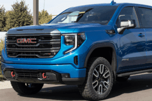 Duramax L5P, diesel repair in Littleton, CO by Branch Automotive. Image of a blue GMC Sierra parked outdoors, showcasing professional care to keep trucks performing at their best.