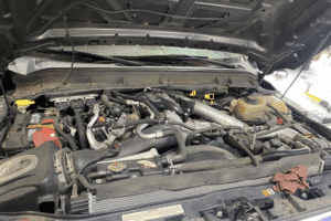 CP4 failure, diesel repair in Littleton, CO by Branch Automotive. Image of engine bay highlighting fuel system components, emphasizing expert troubleshooting and solutions for CP4 failure and diesel performance issues.